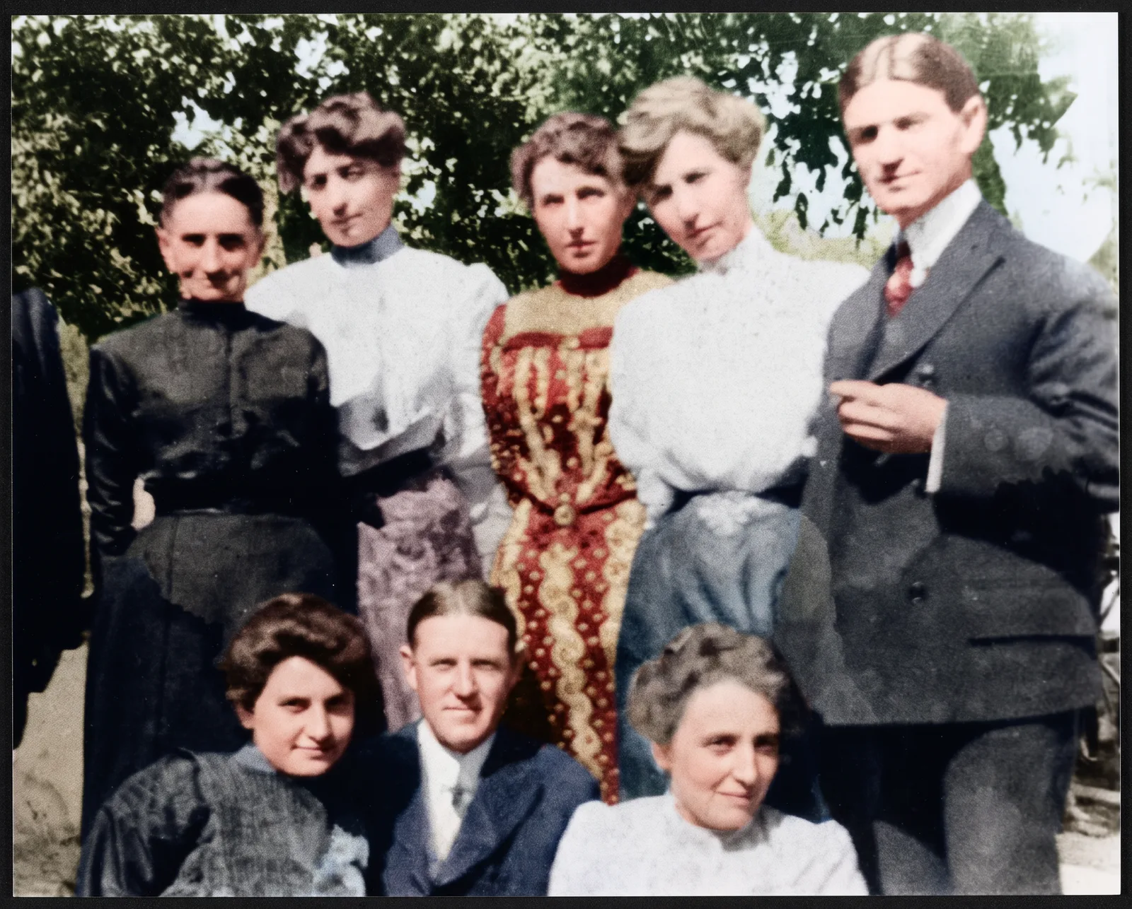 Restored: A family group of eight photographed outdoors in 1904
