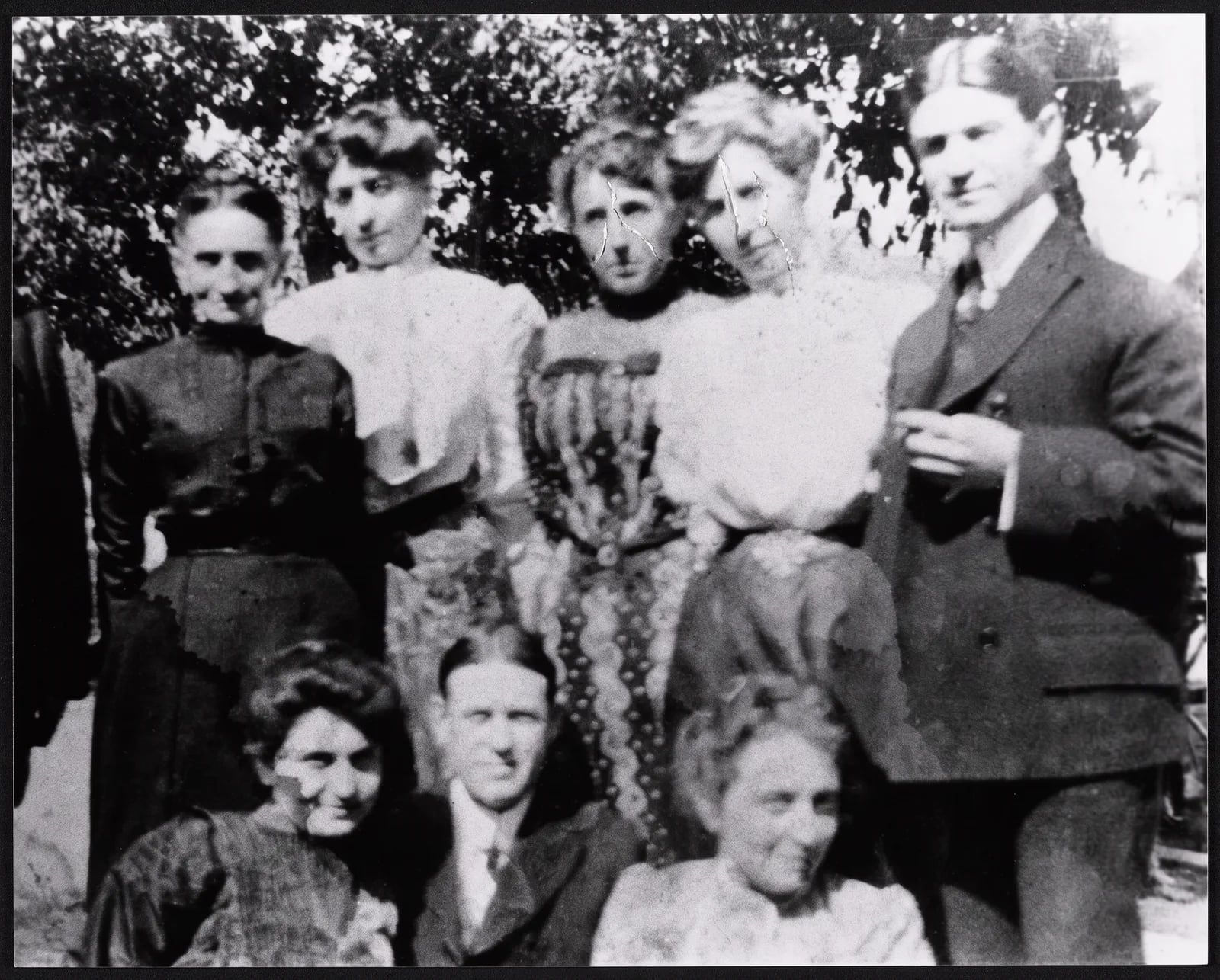 Restored: A family group of eight photographed outdoors in 1904